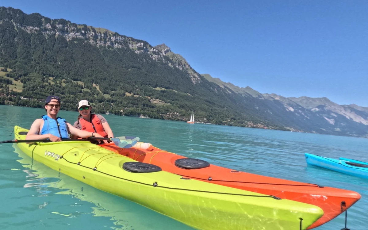 Kayakers on the turquoise water of Lake Brienz near Interlaken