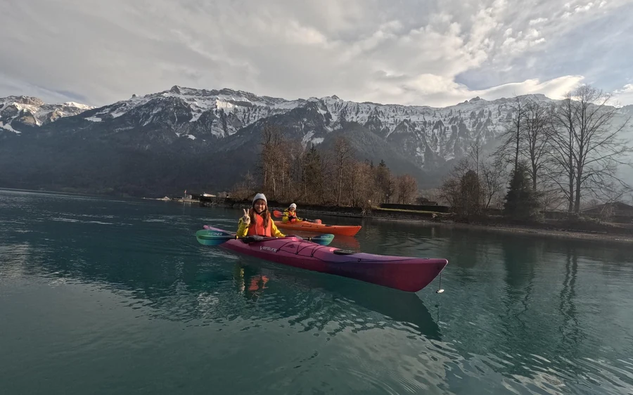 Kayakers in dry suits on Lake Brienz in winter
